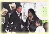 Bush poses with second grade teacher Sandra Kay Daniels